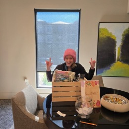 Congratulations to the winner of our Fall Basket Giveaway! a person posing with a gift basket